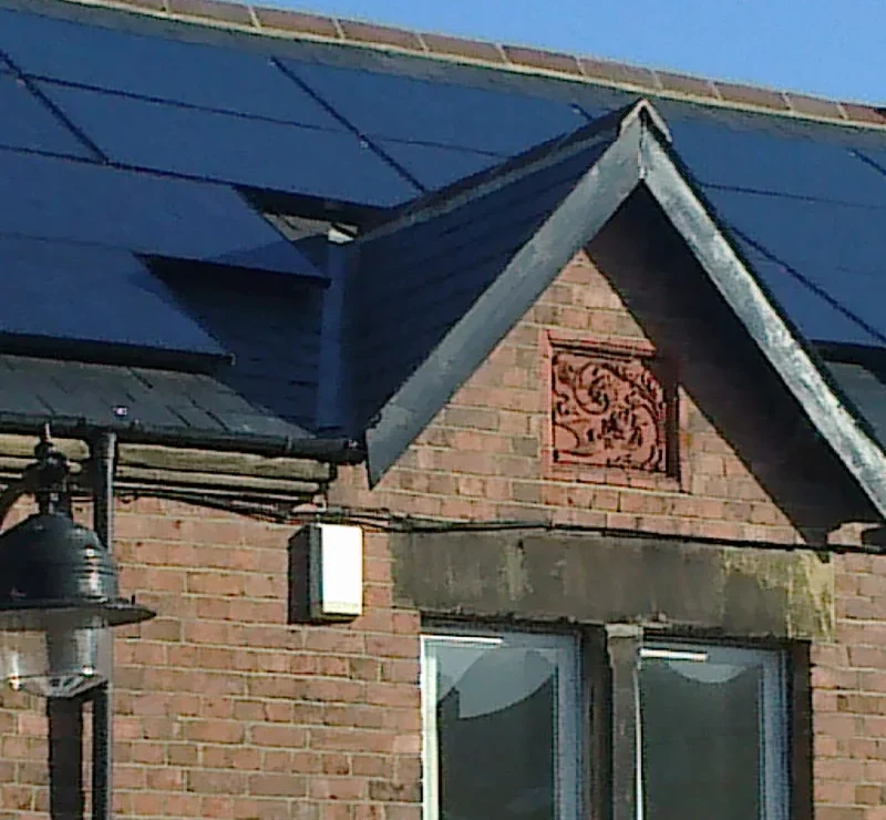 solar panels densely covering a tile roof