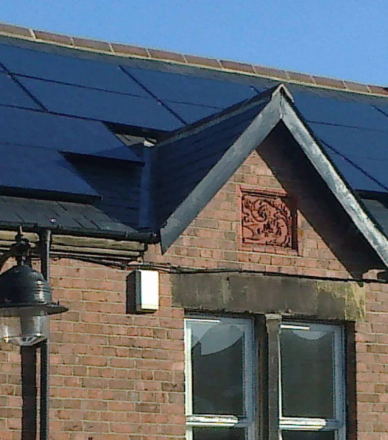 solar panels densely covering a tile roof