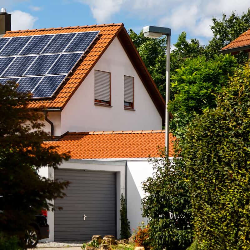 Solar pv on white home with garage